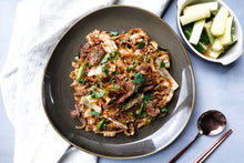 Load image into Gallery viewer, Cumin Lamb Noodles w/ Cucumber Salad
